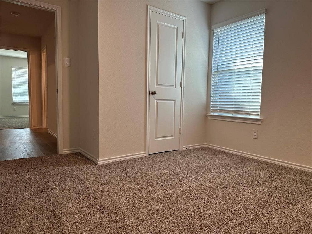 219 Greenshade, Caddo Mills, TX 75135 Unfurnished room with carpet flooring and baseboards