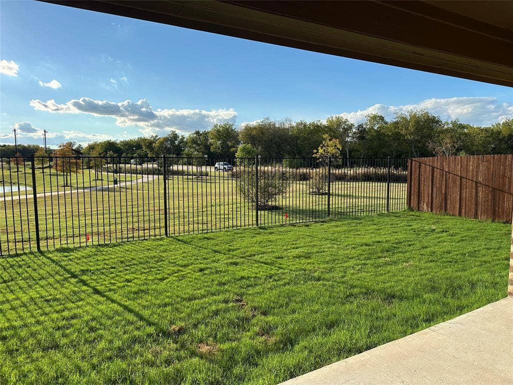219 Greenshade, Caddo Mills, TX 75135 View of yard with a patio