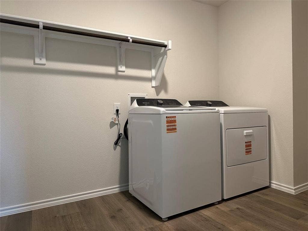 219 Greenshade, Caddo Mills, TX 75135 Laundry area featuring dark wood-style floors and washing machine and clothes dryer