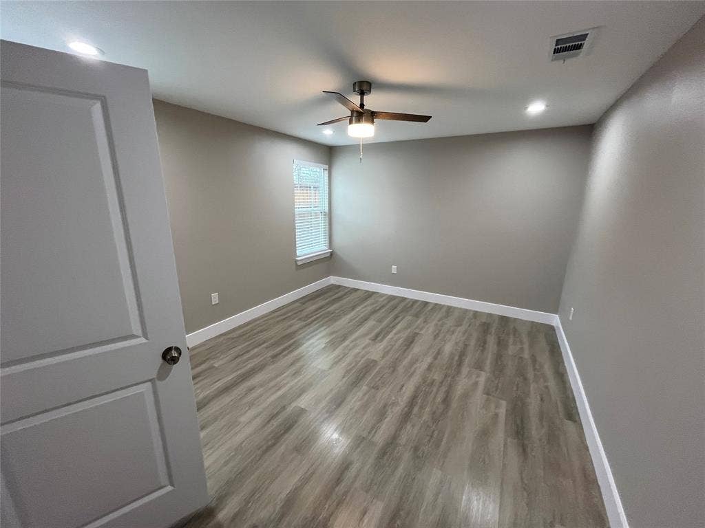 1104 Wake Drive, Richardson, TX 75081 Interior space featuring wood-finish flooring, recessed lighting, a ceiling fan with integrated light fixture, and a single-hung window