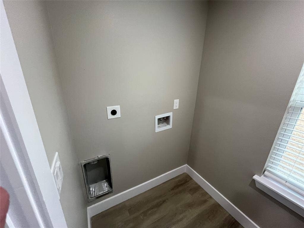 1104 Wake Drive, Richardson, TX 75081 Dedicated utility space featuring wood-finish flooring, a recessed dryer vent, plumbing hookups, and a window with blinds
