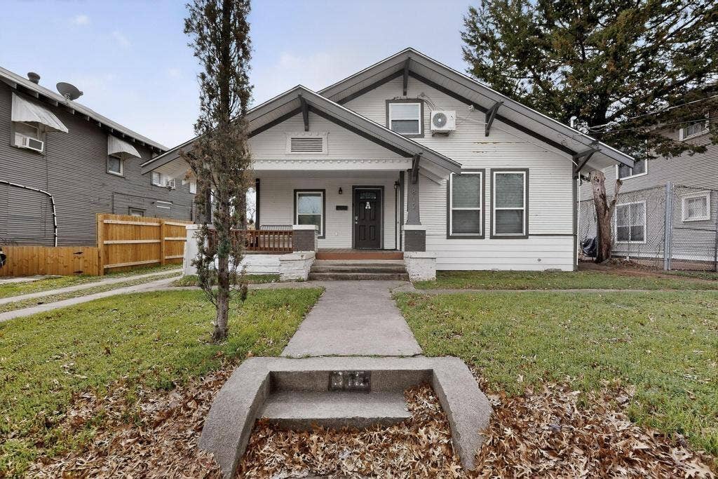 812 Centre Street, Dallas, TX 75208 Craftsman-style exterior featuring a covered front porch with tapered columns, horizontal wood siding, a concrete walkway, and gable roofline details