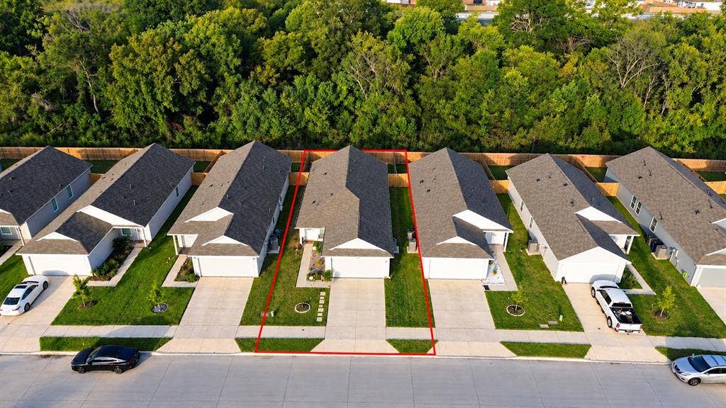 6742 Highlands Street, Princeton, TX 75407 Single-story residence featuring an asphalt shingle roof, attached garage, concrete driveway, and front lawn