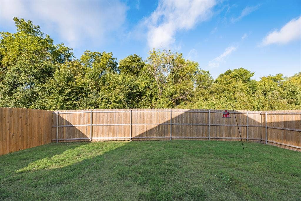 6742 Highlands Street, Princeton, TX 75407 Backyard featuring a grass lawn and wood privacy fencing
