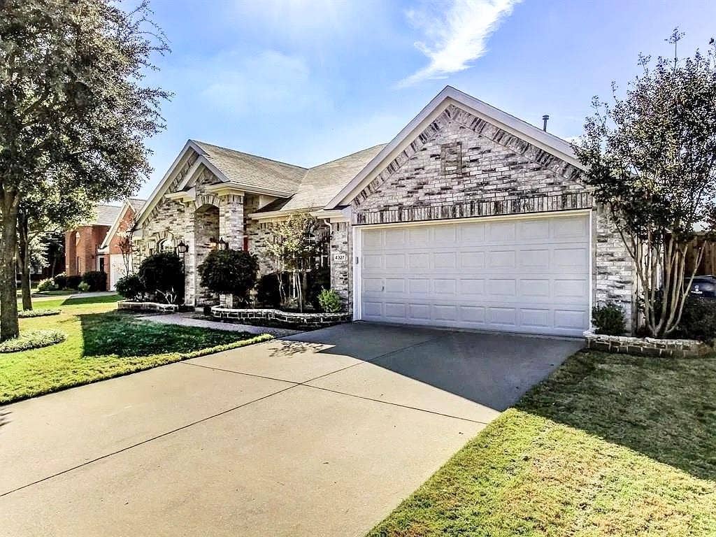 4327 Chasemoor Place, Frisco, TX 75035 Multi-gabled exterior featuring brick masonry, a double-car garage, and concrete driveway