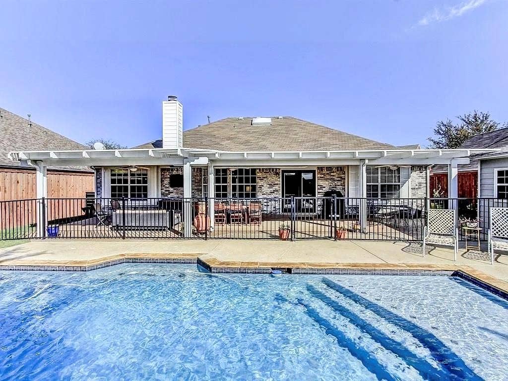 4327 Chasemoor Place, Frisco, TX 75035 In-ground swimming pool with steps, concrete patio, covered pergola, brick exterior, and metal fencing