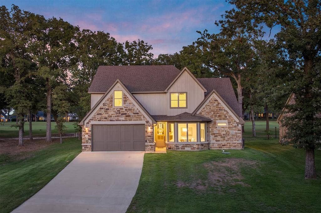 375 St. Andrews Drive, Mabank, TX 75156 Classic farmhouse facade perched on a gentle hill