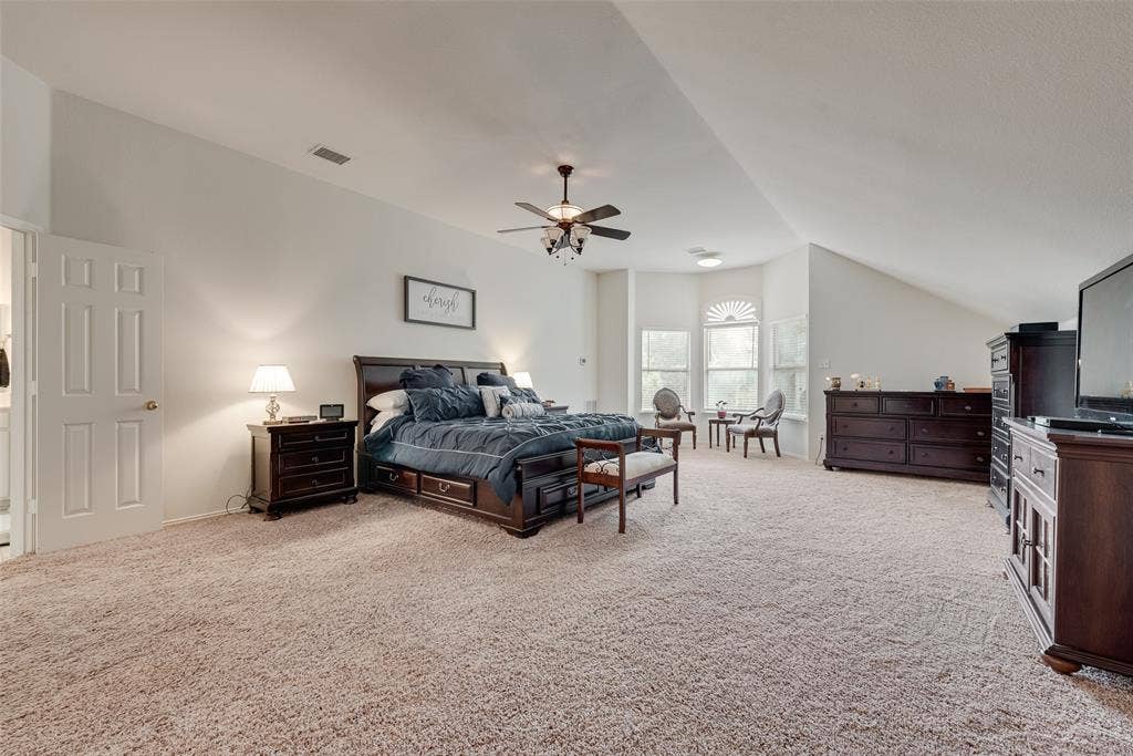 148 Oakbluff Drive, Murphy, TX 75094 Vaulted ceilings, carpeting, a multi-windowed alcove, and an overhead ceiling fan fixture