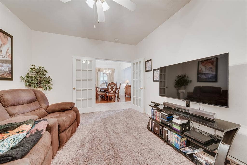 148 Oakbluff Drive, Murphy, TX 75094 Room featuring neutral wall finishes, carpeting, a ceiling fan, and white French doors with glass panes