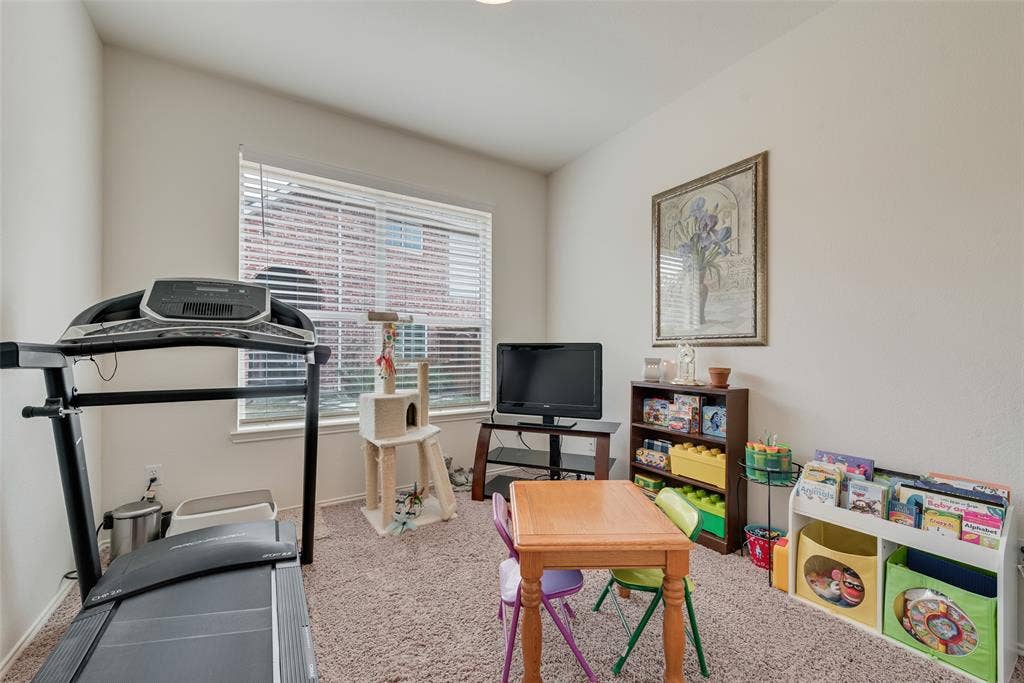 148 Oakbluff Drive, Murphy, TX 75094 Room featuring neutral wall tones, wall-to-wall carpeting, and a window with installed horizontal blinds