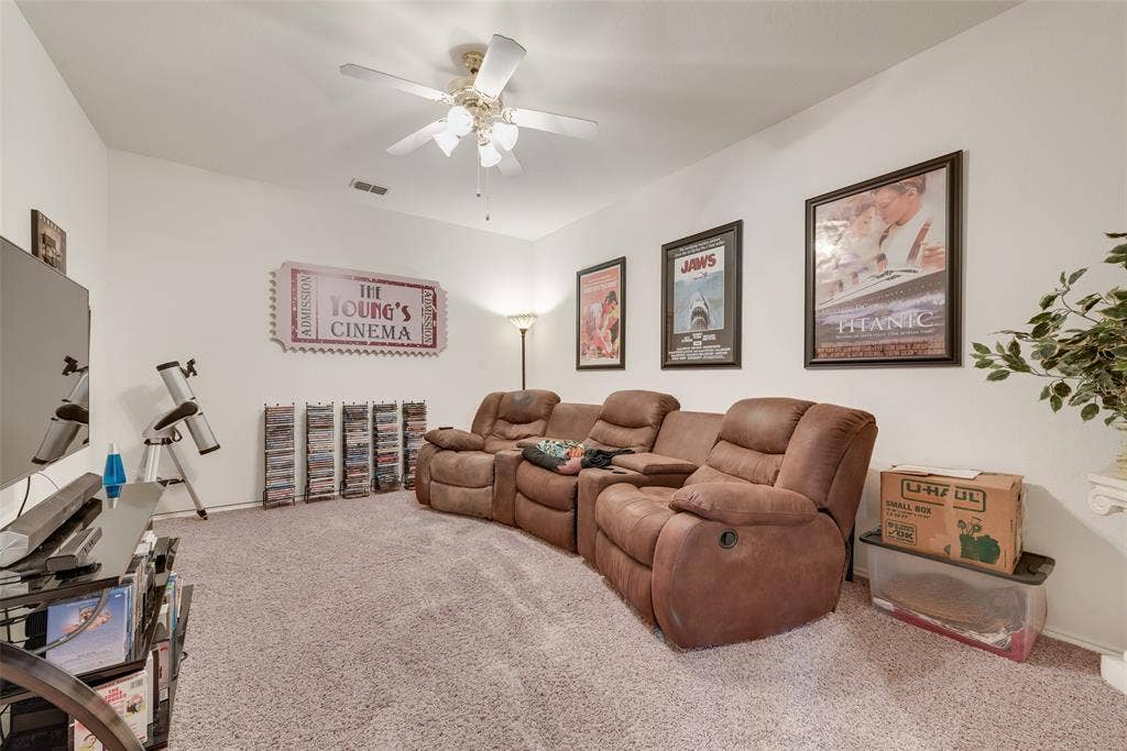 148 Oakbluff Drive, Murphy, TX 75094 Enclosed room featuring carpeting and a central ceiling fan with multi-light fixture