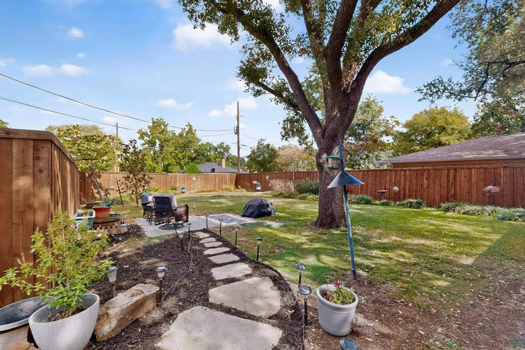 910 Sharpshire Street, Grand Prairie, TX 75050 Wonderful large backyard with plenty of shade