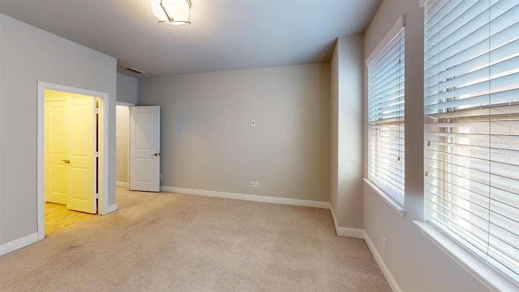7005 Golf Club Drive, McKinney, TX 75070 Neutral-toned interior featuring wall-to-wall carpeting, multi-pane windows with horizontal blinds, recessed ceiling lighting, and solid-core interior doors