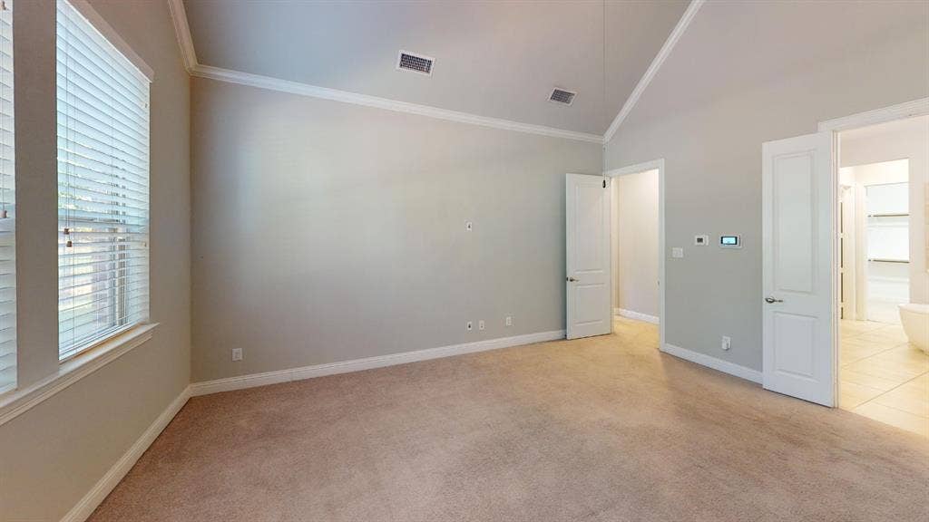 7005 Golf Club Drive, McKinney, TX 75070 Vaulted ceiling featuring neutral wall paint, carpeting, and multi-panel interior doors
