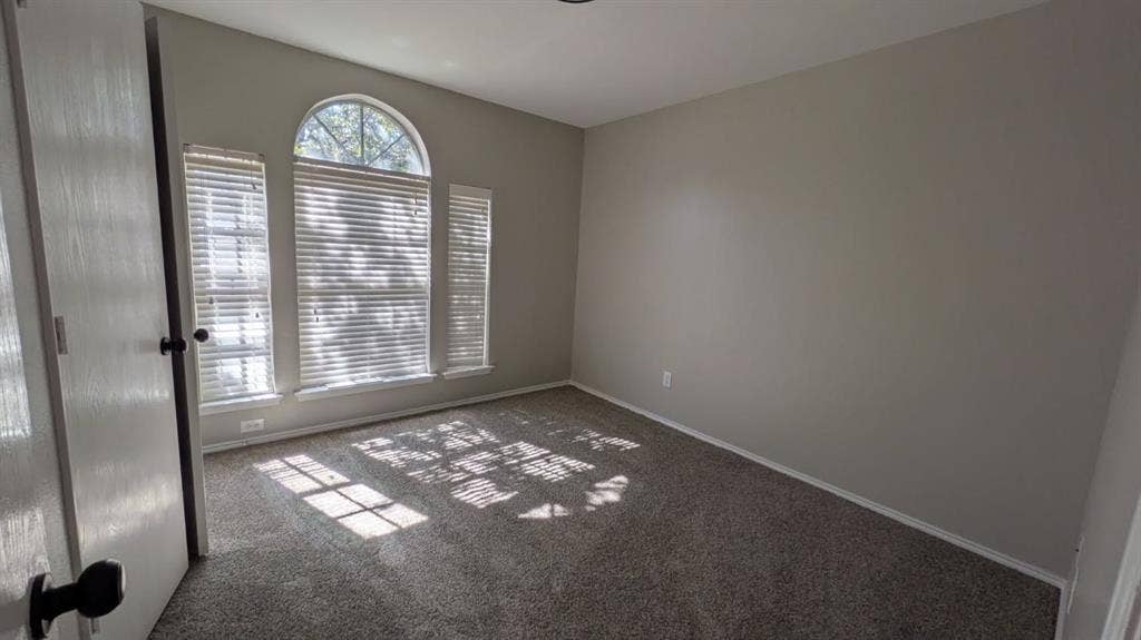 408 Oxford Loop Loop, Princeton, TX 75407 Room featuring wall-to-wall carpeting and an arched window assembly