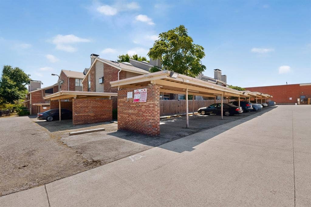 5750 Phoenix Drive, #6, Dallas, TX 75231 Covered parking structures with brick supports and metal roofing