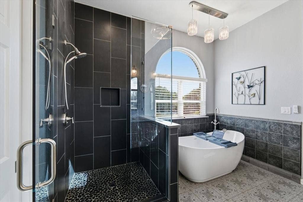 Relaxing soaker tub with separate shower.