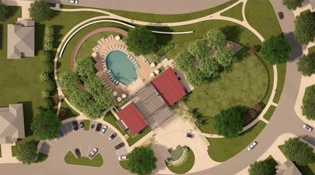 Aerial rendering of community amenities featuring a swimming pool, expansive paved pool deck, covered pavilion, dedicated parking area, and landscaped green space