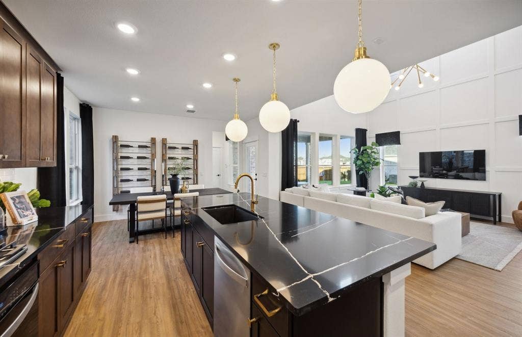 1308 Holmes Street, Celina, TX 75009 *Model Representation - Large island gathering room and dining areas overlooking