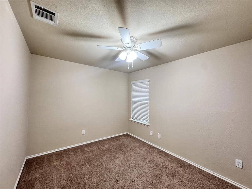 2105 Meadow Park Drive, Princeton, TX 75407 Room featuring neutral wall tones, plush carpeting, a multi-blade ceiling fan with an integrated light fixture, and horizontal window blinds