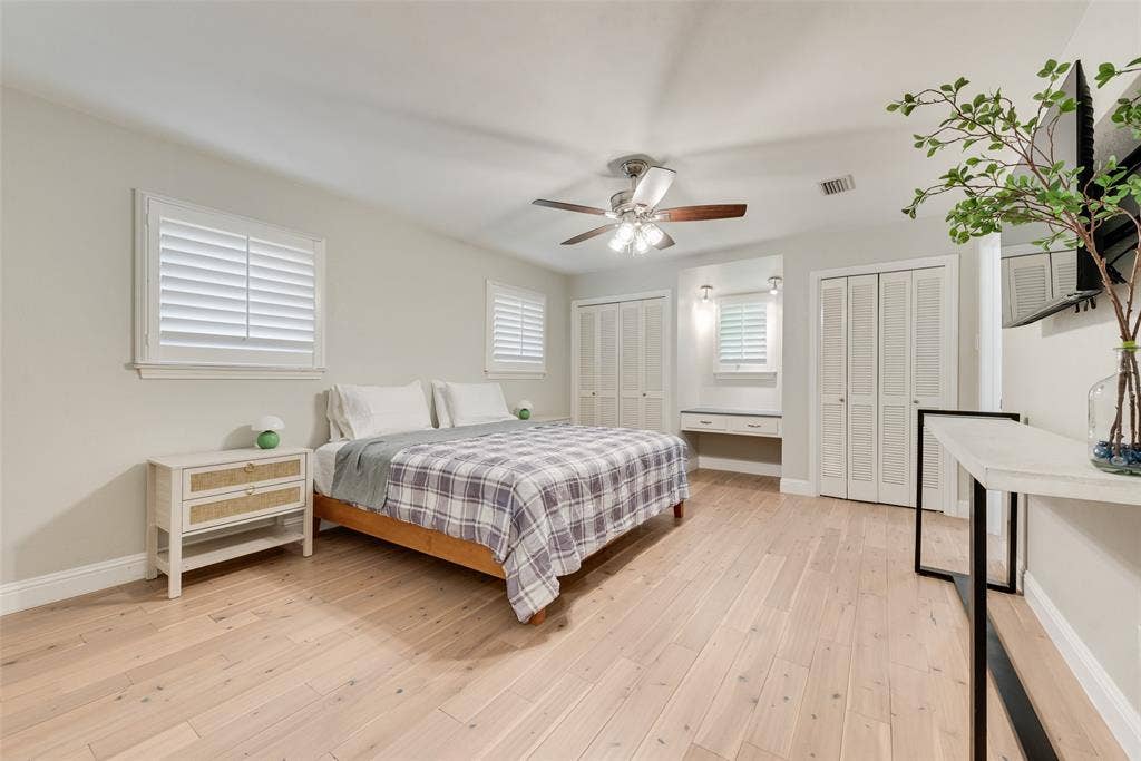 620 Cox Drive, Irving, TX 75062 Single-story residence featuring a pitched roof, expansive front lawn, mature trees, and a paved driveway