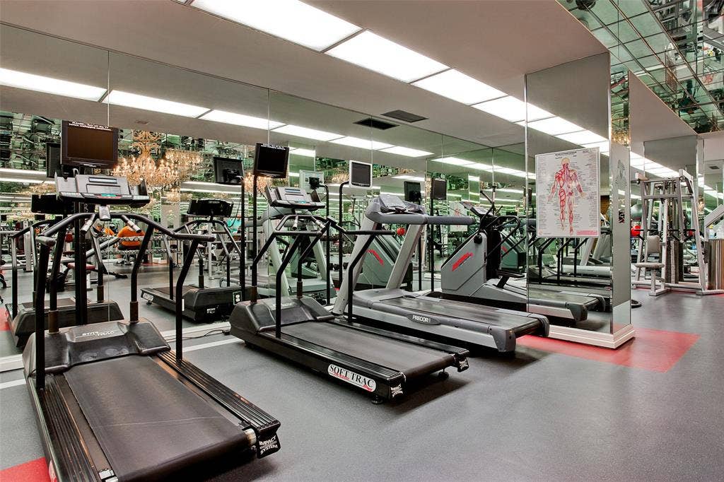 5200 Keller Springs Road, #522, Dallas, TX 75248 Fitness room featuring full-wall mirrored surfaces, recessed ceiling lighting, and resilient composite flooring