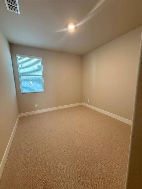 1313 Winters Way, Princeton, TX 75071 Neutral-toned interior space featuring neutral wall paint, wall-to-wall carpeting, and a window with horizontal blinds