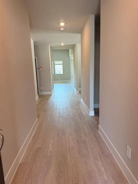 1313 Winters Way, Princeton, TX 75071 Hallway featuring neutral wall tones, wood-finish flooring, and recessed ceiling lighting