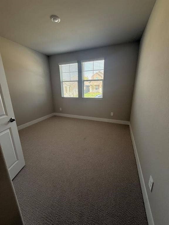 1313 Winters Way, Princeton, TX 75071 Room featuring neutral wall tones, wall-to-wall carpeting, dual windows with integrated blinds, and a recessed ceiling light