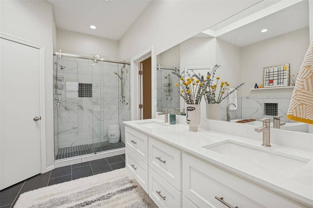 Primary bathroom with double shower and duel sinks