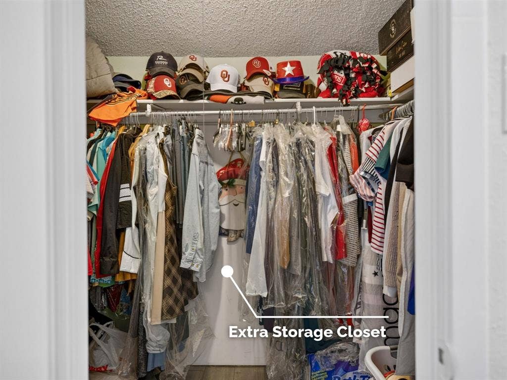 2851 Ursa Circle, Garland, TX 75044 Walk-in closet featuring upper shelving and a full-width hanging rod