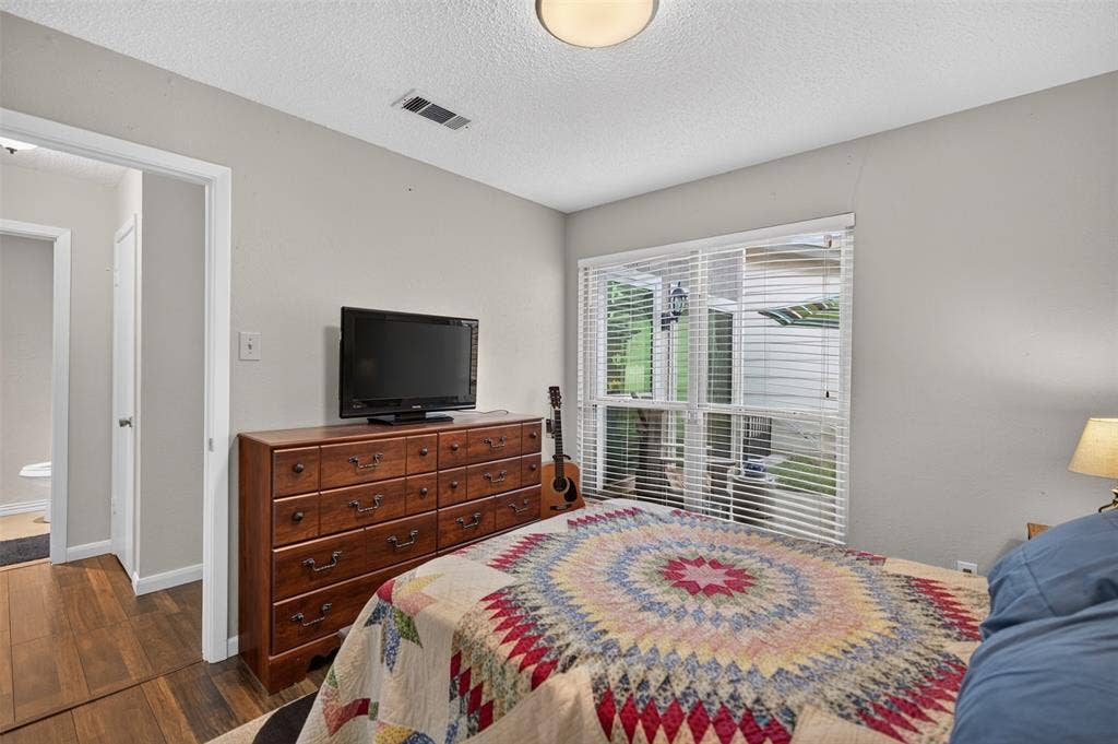 2851 Ursa Circle, Garland, TX 75044 Neutral wall tones, ceiling-mounted lighting, and dual white bi-fold closet doors