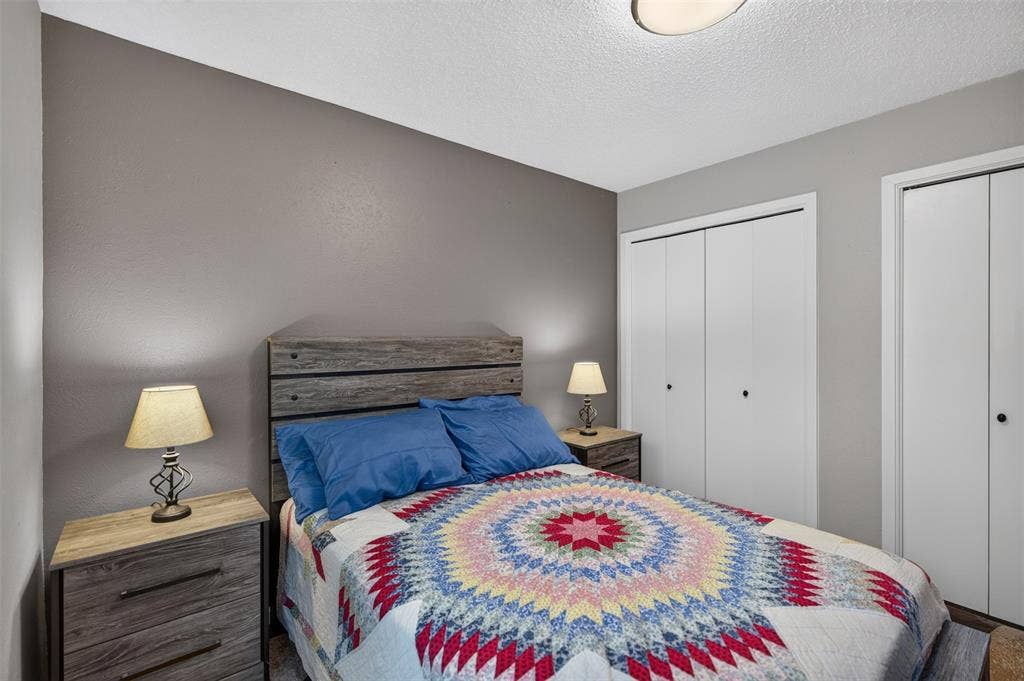 2851 Ursa Circle, Garland, TX 75044 Neutral wall tones, ceiling-mounted lighting, and dual white bi-fold closet doors