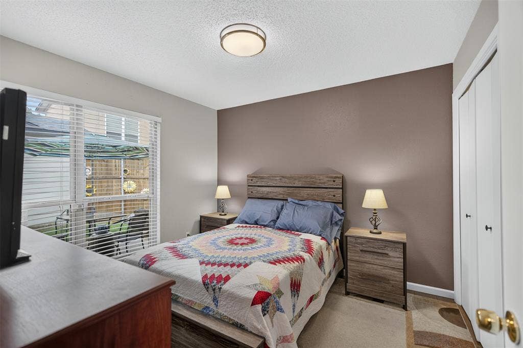 2851 Ursa Circle, Garland, TX 75044 Neutral wall tones, ceiling-mounted lighting, and dual white bi-fold closet doors