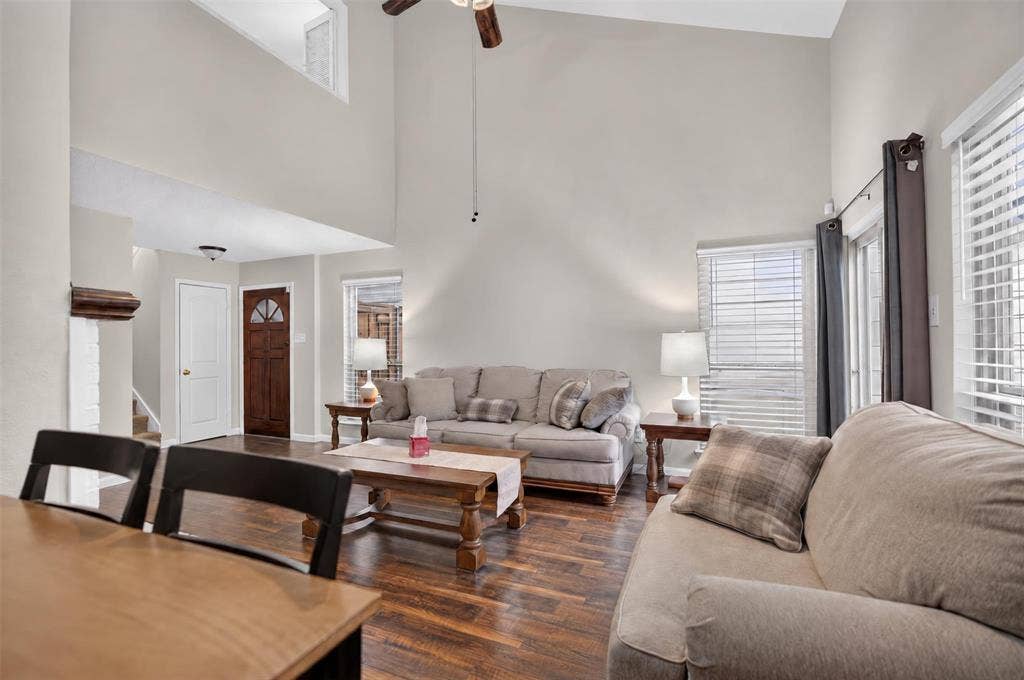 2851 Ursa Circle, Garland, TX 75044 Vaulted ceilings, wood-finish flooring, recessed lighting, and large windows with horizontal blinds