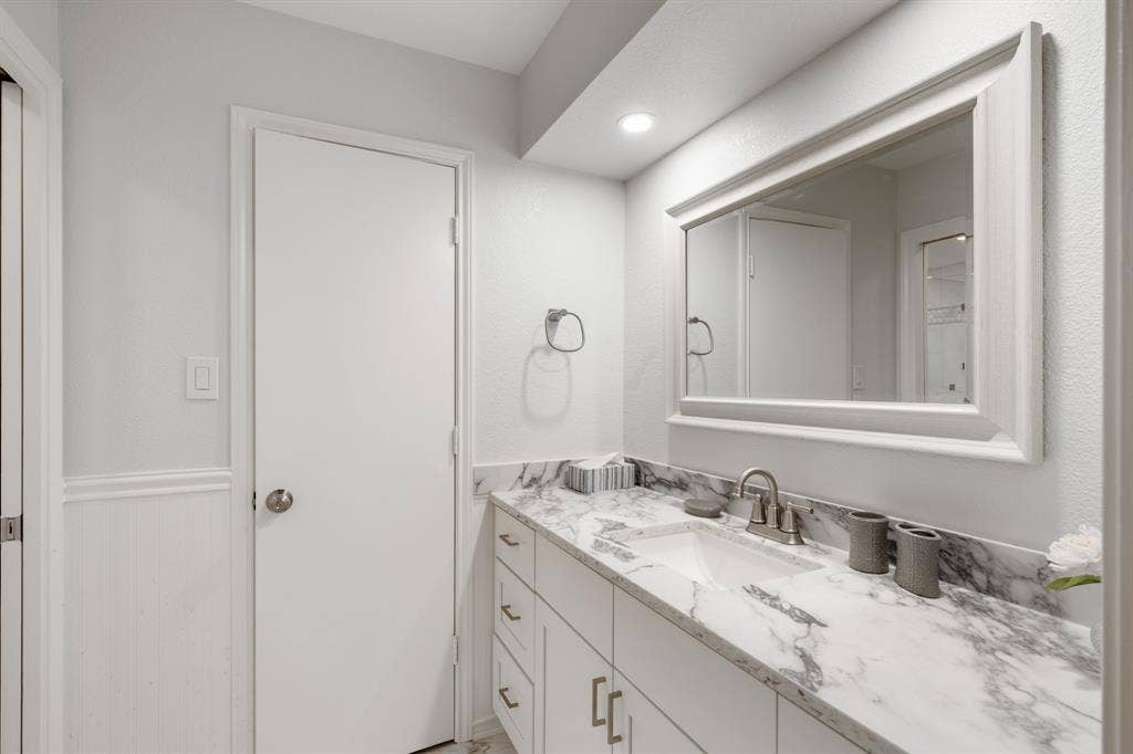 2510 Buttercup Drive, Richardson, TX 75082 Primary bathroom features granite counters and storage built in.