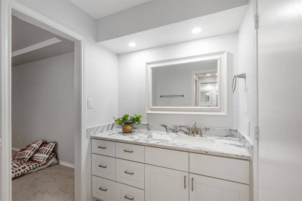 2510 Buttercup Drive, Richardson, TX 75082 Built in storage in primary bathroom with a walk in closet.