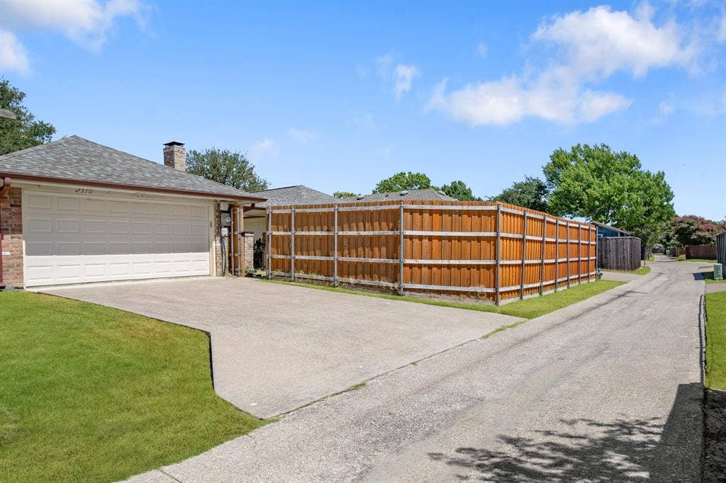 2510 Buttercup Drive, Richardson, TX 75082 2 car garage with access to backyard.