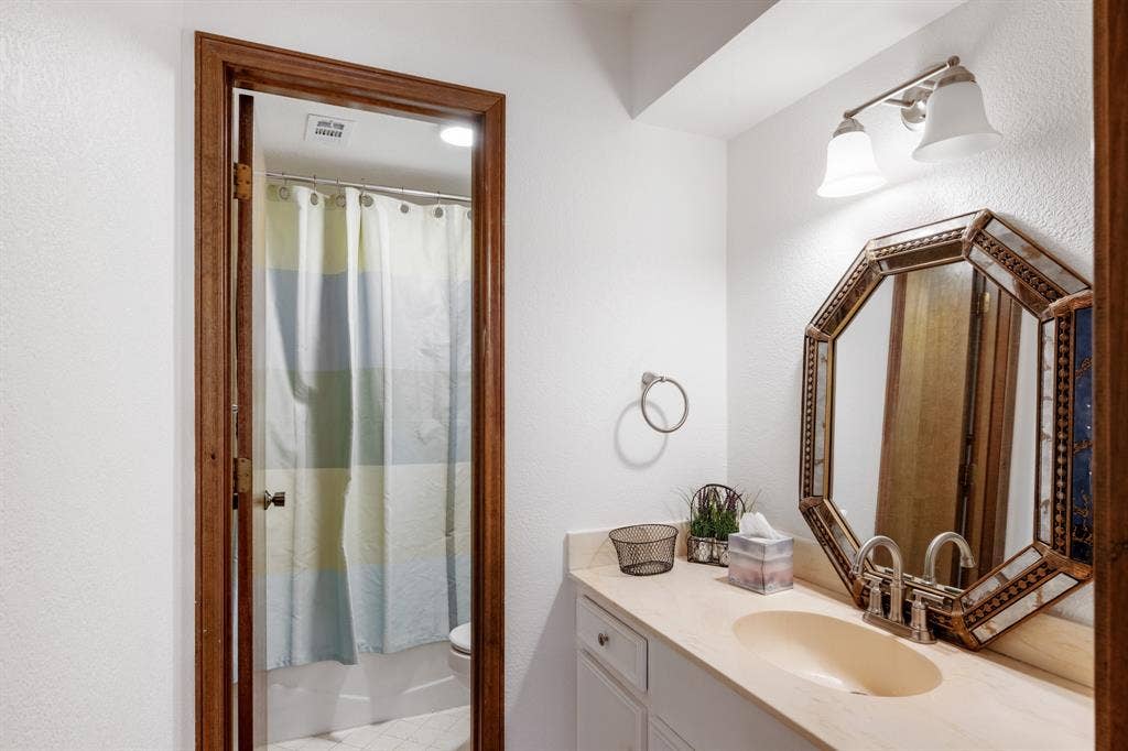 2510 Buttercup Drive, Richardson, TX 75082 Secondary bathroom with built in storage.