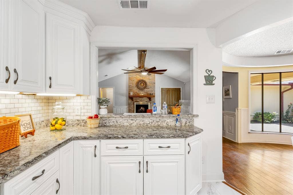 2510 Buttercup Drive, Richardson, TX 75082 Kitchen has a breakfast bar and a view of the living room.