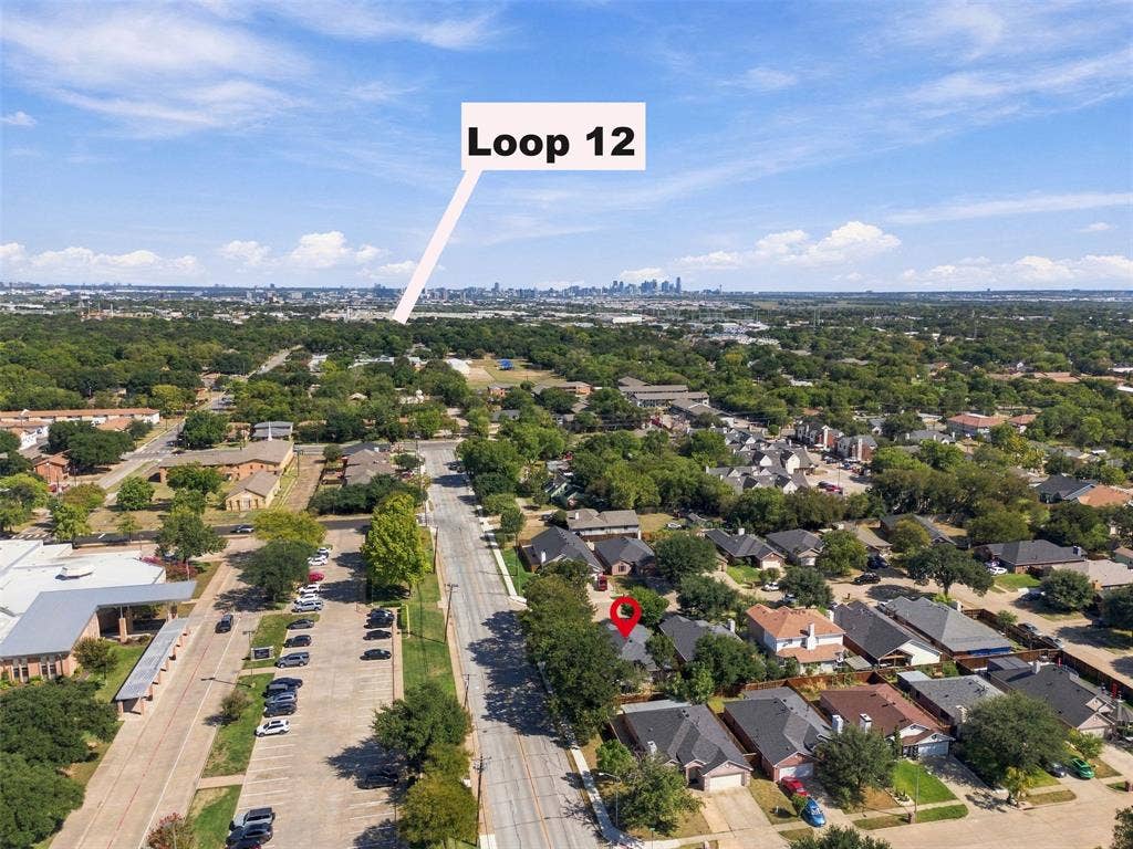 873 Hope Lane, Irving, TX 75061 Aerial perspective of the residential property situated within an established suburban setting featuring mature tree canopy and surrounding thoroughfares