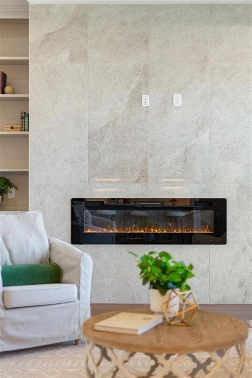 168 Water View Lane, Robinson, TX 76706 Floor to ceiling tile highlights electric fireplace