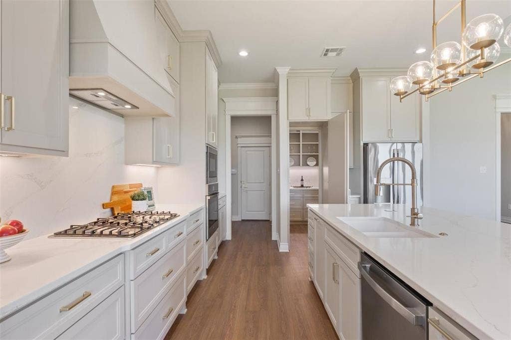 168 Water View Lane, Robinson, TX 76706 Hidden pantry door open to 140 square foot pantry with built ins