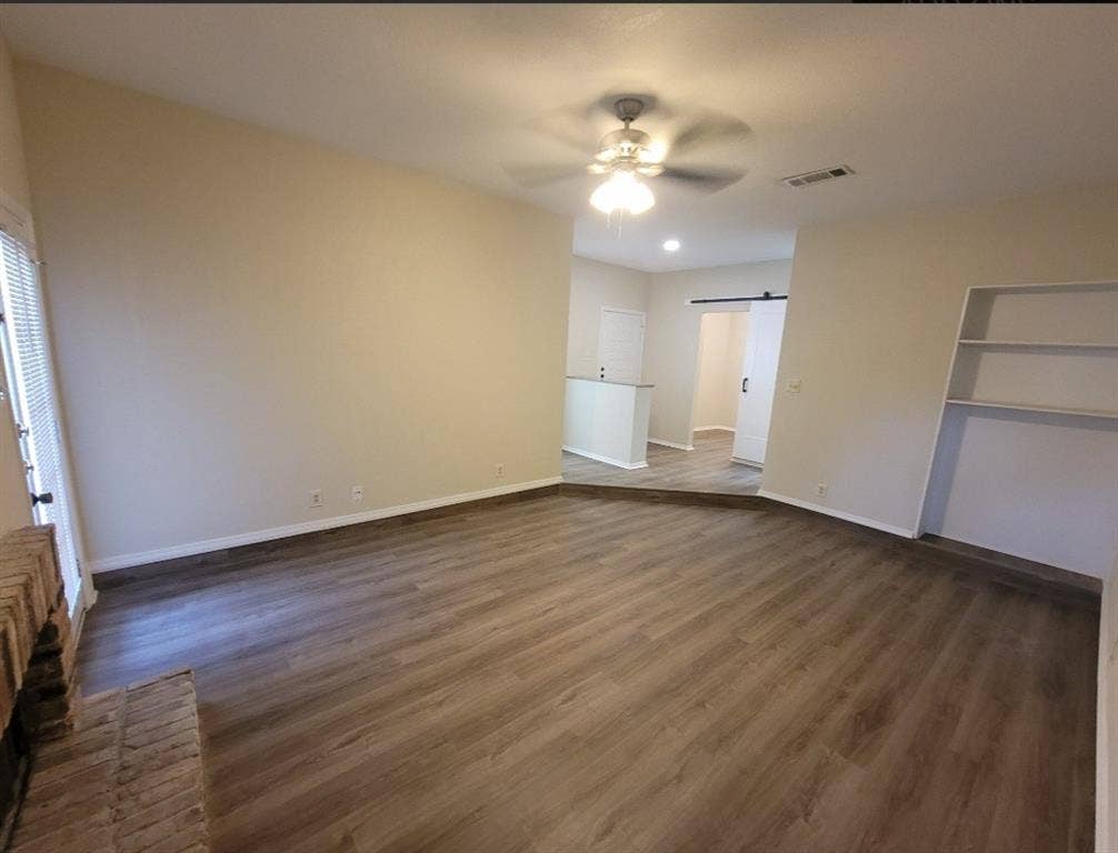 5616 PRESTON OAKS, #1101, Dallas, TX 75254 Living room with fireplace, built-in shelf & fan