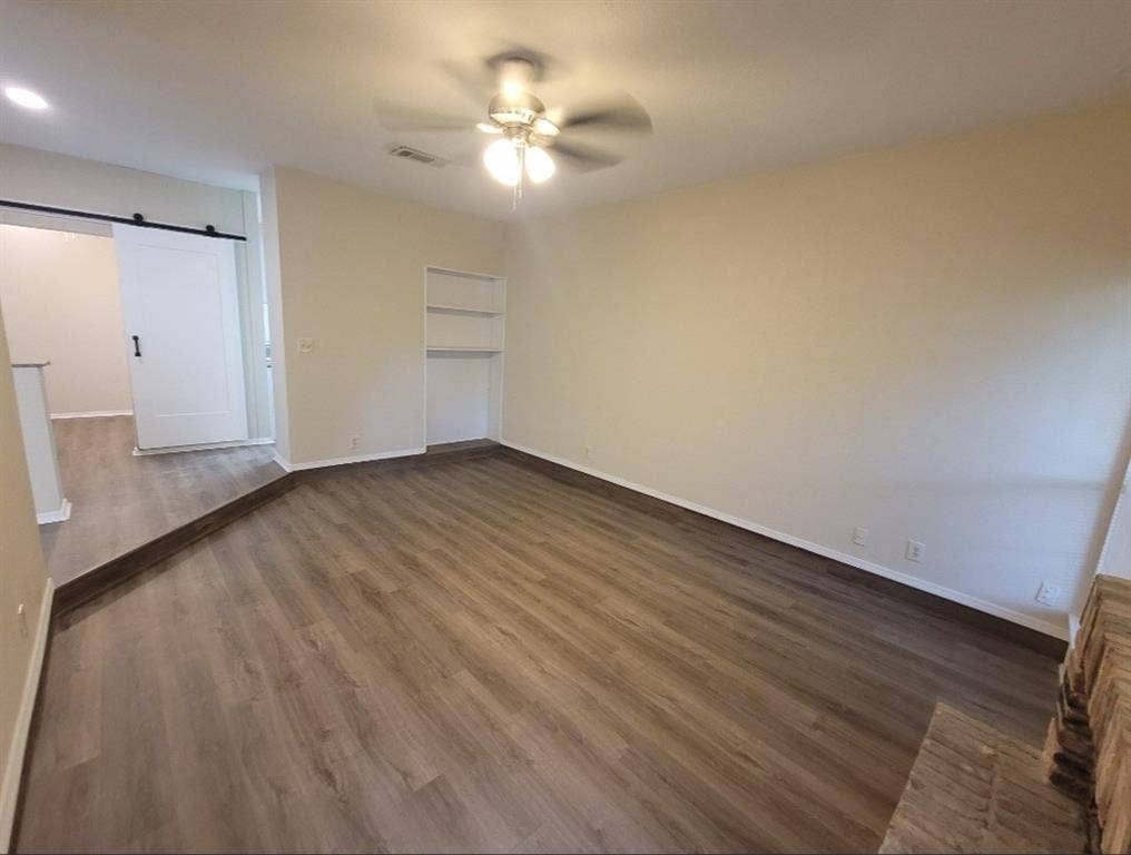 5616 PRESTON OAKS, #1101, Dallas, TX 75254 Living room with fan and built in shelving