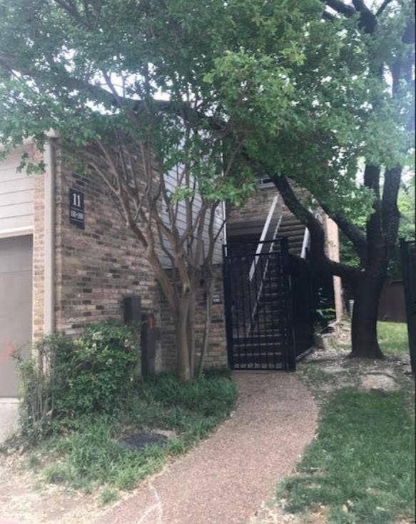 5616 PRESTON OAKS, #1101, Dallas, TX 75254 View of front of home featuring a garage and a gate