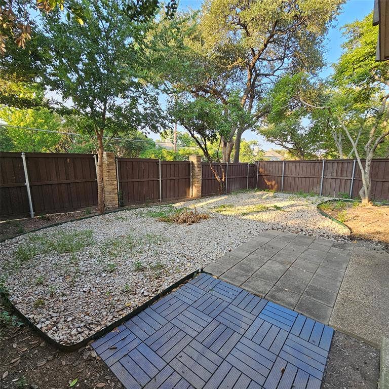 5616 PRESTON OAKS, #1101, Dallas, TX 75254 Fenced backyard with a patio