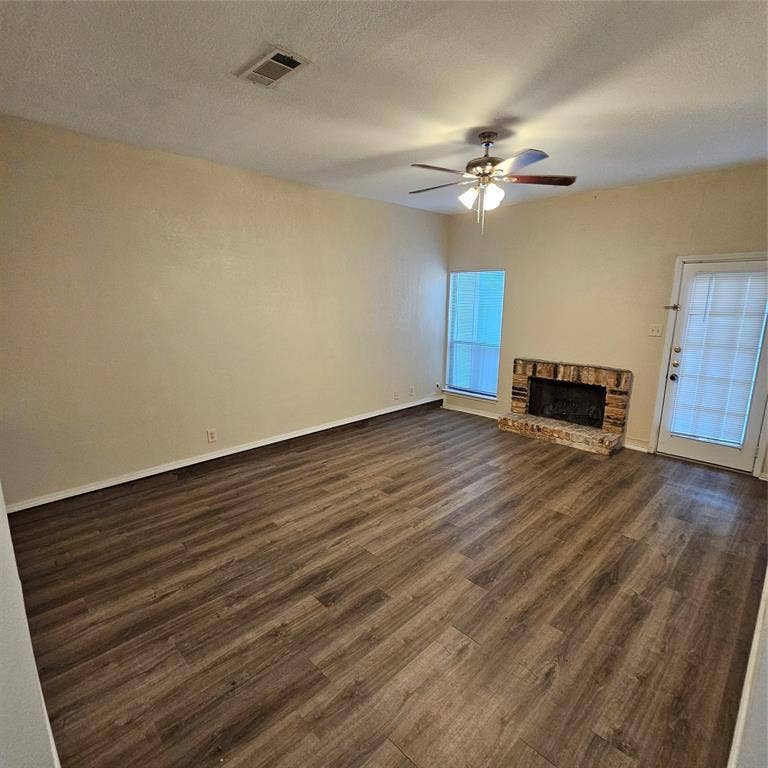 5616 PRESTON OAKS, #1101, Dallas, TX 75254 Living room with fan and fireplace