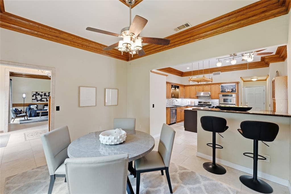 1509 Aylesbury Lane, Plano, TX 75075 Dining room open to kitchen and breakfast bar style island.