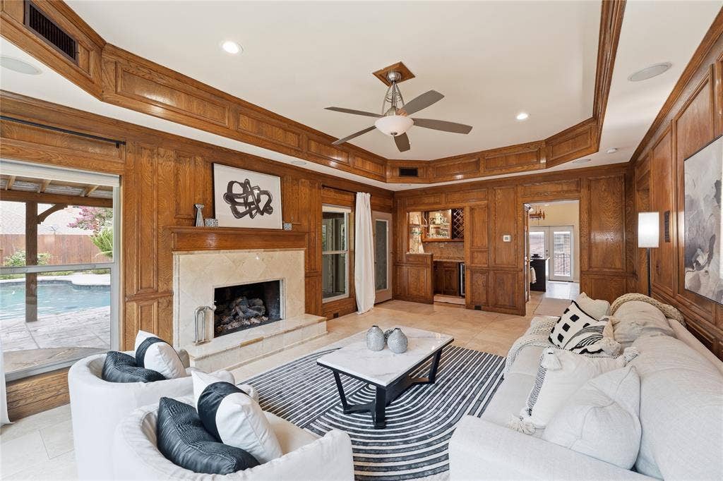1509 Aylesbury Lane, Plano, TX 75075 Enjoy a nice cup of coffee next to this cozy fireplace while enjoying the amazing outdoor view.